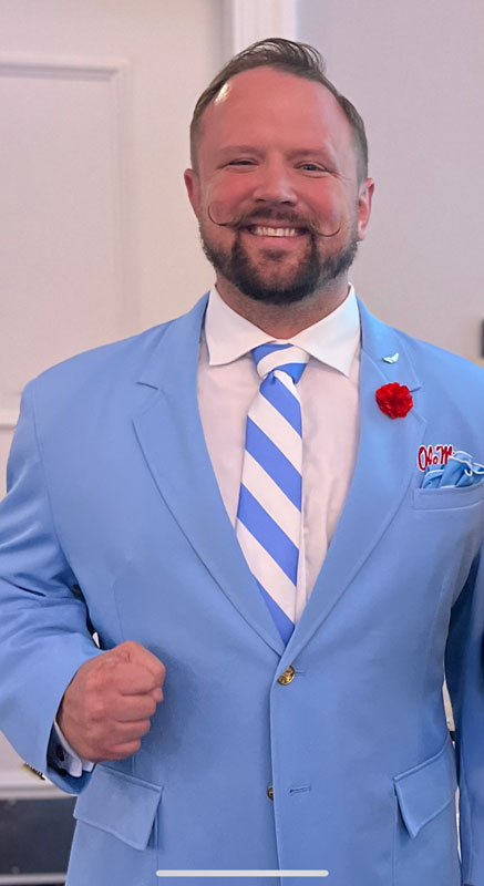 Man In Light Blue Suit