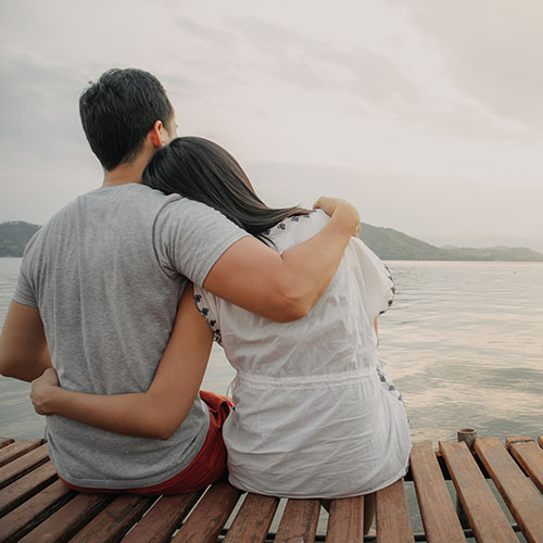Lover Couple Hold Together And Admire The Romantic Beautiful Lak