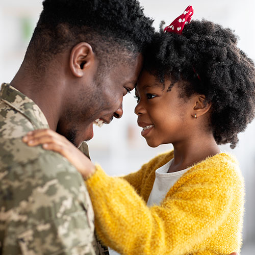 Portrait Of Happy African American Soldier Dad Reunited With His Daughter